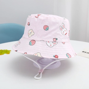 Detail of pink cotton sun hat with cartoon animal prints and adjustable chin strap