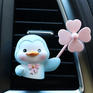 Cute blue duck car aromatherapy clip with pink clover propeller on air vent