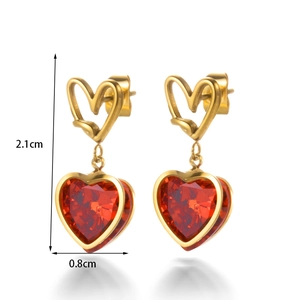 Gold plated stainless steel earrings featuring a red heart pendant and cubic zirconia studs