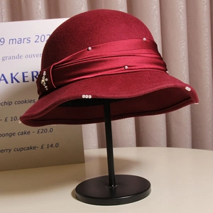 Vintage burgundy wool cloche hat with satin ribbon, pearls and rhinestone brooch detail