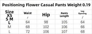 Tableau des tailles détaillé pour pantalon floral avec mesures de taille et hanches