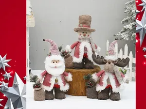 Detail of Christmas plush figures with Santa, snowman and reindeer on wooden bases