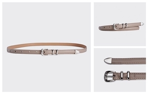 Detail view of khaki PU leather belt with silver pin buckle and metal end decoration