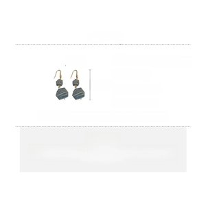 Detail view of copper earrings with blue wood beads and zircon showing 5.5cm length