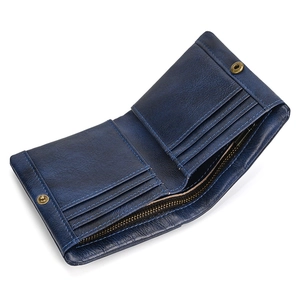 Detail of blue genuine leather wallet interior with card slots and a metal zipper pocket