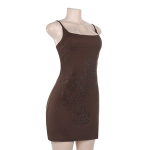 Detail of the sparkling rhinestone floral pattern on a brown slim-fit bodycon mini dress