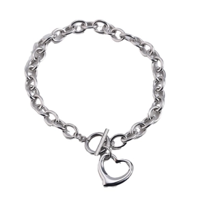 Polished stainless steel OT clasp bracelet with a minimalist hollow heart charm pendant