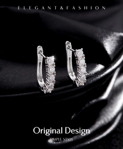 Detailed view of S925 sterling silver hoop earrings with sparkling VVS1 moissanite stones