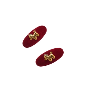 Set of two vintage deep red plush oval hair clips with golden dog and star accents