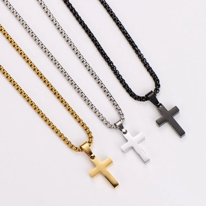 Polished stainless steel cross necklaces in gold, silver, and black finishes