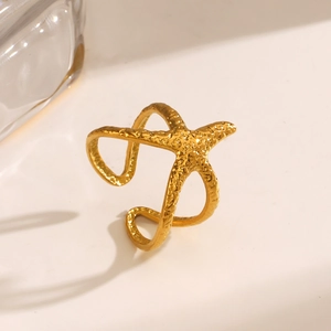 Golden starfish ring with hammered texture and adjustable open band for beach fashion