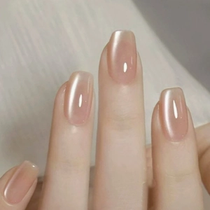 Champagne pink aurora cat eye press-on nails with shiny metallic finish in square-oval shape