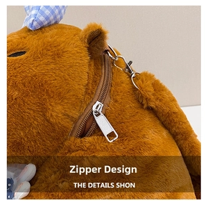 Close-up of the smooth metal zipper and plush brown fabric on a capybara backpack