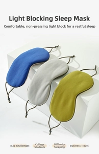 Close-up of breathable mesh sleep masks in blue, gray and yellow with adjustable straps