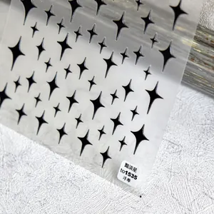Detailed macro view of TO1535 black 5D embossed star nail art stickers with textured finish