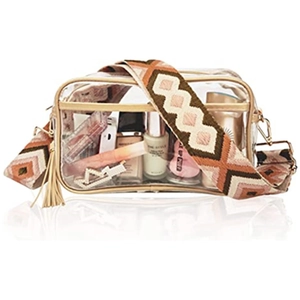 Detail of transparent PVC crossbody bag with ethnic pattern strap and leather tassels