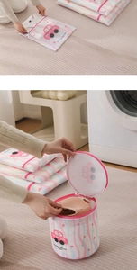 Detail of printed fine mesh laundry bags with wave patterns and pink protective zippers