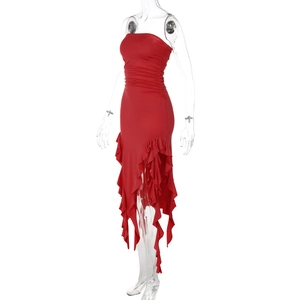 Detail of red strapless dress featuring ruched waist and asymmetric ruffled hemline