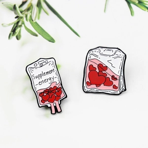 Creative alloy enamel pins featuring blood bag and supplement energy heart shapes
