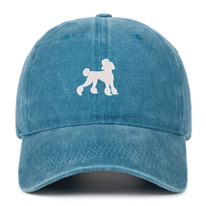 Close-up of white poodle embroidery on vintage washed blue denim baseball cap