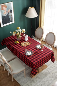 Close-up of red and black buffalo plaid tablecloth with premium hemmed edge texture