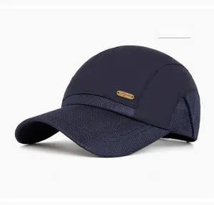 Detail of navy blue mesh baseball cap showing breathable fabric and metal logo plaque