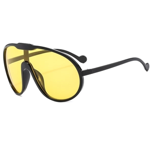 Fashion oversized single-lens sunglasses with black frame and vibrant yellow tinted lenses