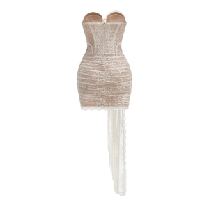 Close-up of lace textures and asymmetric train on a strapless bone-structured party dress