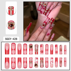 Long french press-on nails with red hearts, 3D rose, rhinestone cross and chain accents