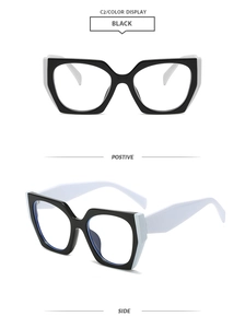 Detail view of stylish geometric square glasses with contrasting black and white temples