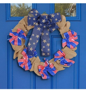 Close-up of patriotic USA Independence Day burlap wreath with stars and stripes bows