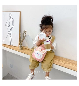 Close-up of pink bunny canvas chest bag for kids with adjustable strap and cute details