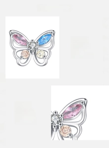 Detail der Schmetterlingsohrringe aus 925er Silber mit rosa und blauen Zirkonia-Steinen