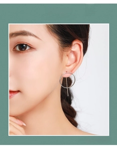 Close-up of minimalist S925 sterling silver hoop earrings with geometric vertical bar design