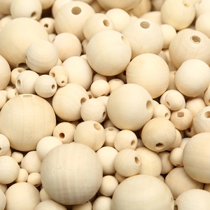 Natural unfinished round wooden beads in various sizes for DIY jewelry and crafts