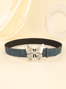 Detail of teal leather belt with floral embossing and a silver butterfly buckle