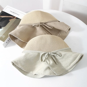 Straw and cloth patchwork sun hat with lace trim and bow in beige and light green