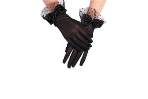 Detail of black polka dot mesh bridal gloves with satin bow and ruffled wrist cuff