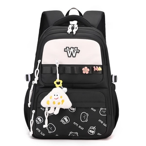 Cute black and white student backpack with cartoon charms and multi-pocket design