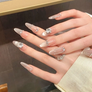 Macro view of luxury cat-eye press-on nails with 3D floral zircons and sparkling crystals