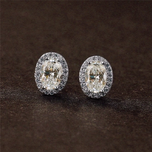 Elegant oval halo stud earrings with sparkling cubic zirconia in silver-tone setting