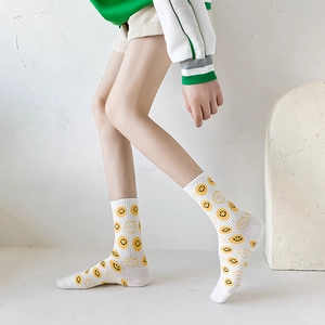 Comfortable cotton mid-calf socks featuring yellow smiley faces and smile typography