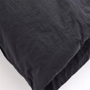 Detailed texture of black casual vest fabric showing high-quality stitching and fiber