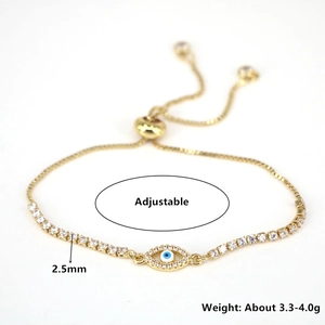 Detail of adjustable golden Evil Eye bracelet featuring white zircon stones and heart shape
