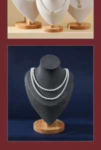 Macro detail of double-layer white pearl necklace with gold clasp on velvet neck display stand