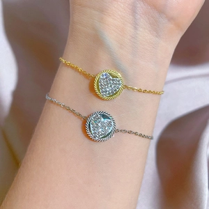 Golden and silver titanium steel chain bracelets with rhinestone heart charms on silk