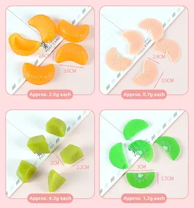 Macro detail of artificial PVC fruit slices showing sizes and weights for DIY cake decor