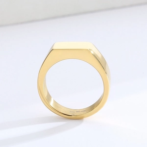 Polished gold stainless steel signet ring with a smooth rectangle surface and mirror finish