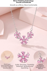 Detailed macro view of pink floral pendant necklace with cubic zirconia and polished silver chain