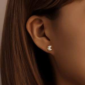 Detailed view of three marquise-cut zircons set in a gold S925 silver stud earring